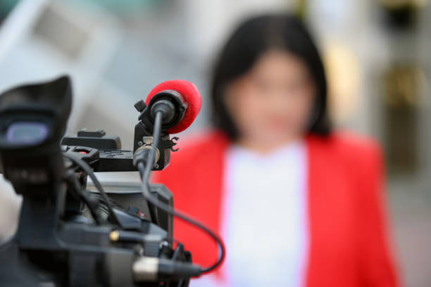istock Female reporter in front of camera 1398616330
