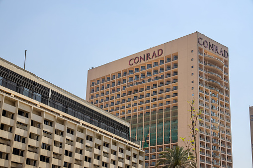 Cairo, Egypt- April 13, 2022: The Conrad hotel in Cairo. Conrad Hotels & Resorts is an American multinational brand of high-end luxury hotels and high-end resorts owned and operated by Hilton Worldwide.