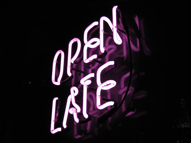 Open late neon sign Neon sign in restaurant window in New york City checking the time stock pictures, royalty-free photos & images