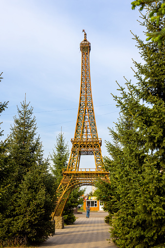 View of the elements and patterns of metal structures of the Eiffel Tower. Patterns, decor and design of steel supports, attachment points and intersections of the bearing elements of the tower.