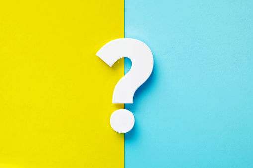Extruded white question mark sitting over yellow and blue background. Horizontal composition with copy space.