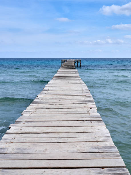 istock Wooden pier in Platja de Muro, Majorca, Spain 1398620658