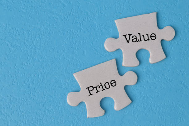 istock Jigsaw puzzle with text PRICE and VALUE isolated on a blue background 1398620743