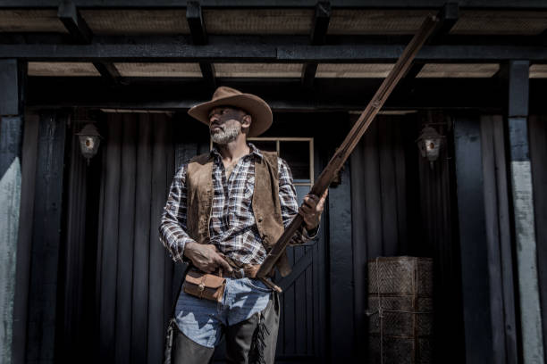 istock Handsome Black Cowboy in an authentic wild west setting 1398621596
