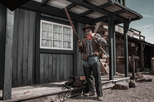 istock Handsome Black Cowboy in an authentic wild west setting 1398621619