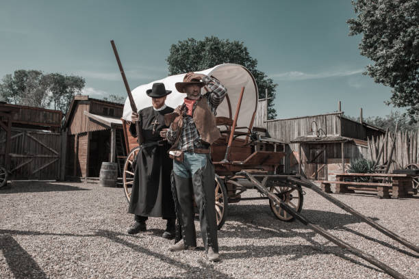 istock Handsome Black Cowboy with a priest in an authentic wild west setting 1398621718