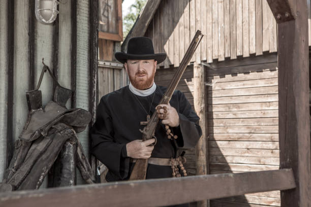 istock Handsome redhead Cowboy priest in an authentic wild west setting 1398621739
