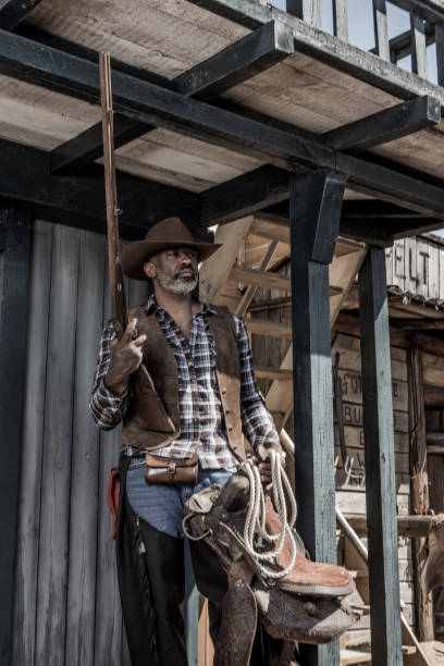 istock Handsome Black Cowboy in an authentic wild west setting 1398621750