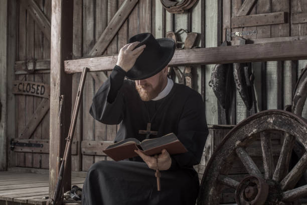 istock Handsome redhead Cowboy priest in an authentic wild west setting 1398621965