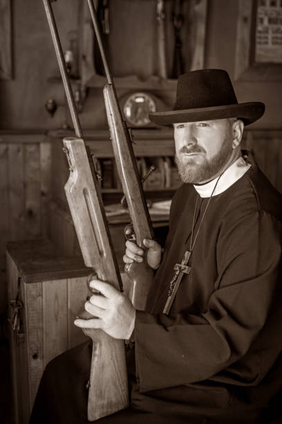istock Handsome redhead Cowboy priest in an authentic wild west setting 1398621988