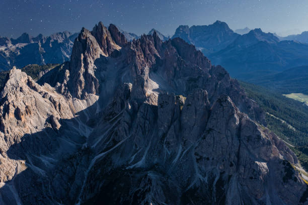 Starry night over Italian alps - Tre Cime di Lavaredo (three peaks of Lavaredo). Italian alps mountains - Drei Zinnen (Tre Cime di Lavaredo) in a cloudless night, full of stars. astrophotography stock pictures, royalty-free photos & images