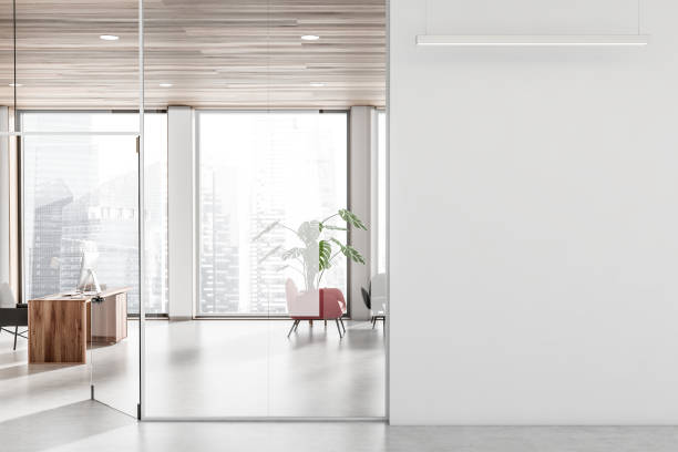 istock Business room interior with work desk and relax zone, window and mockup 1398624287