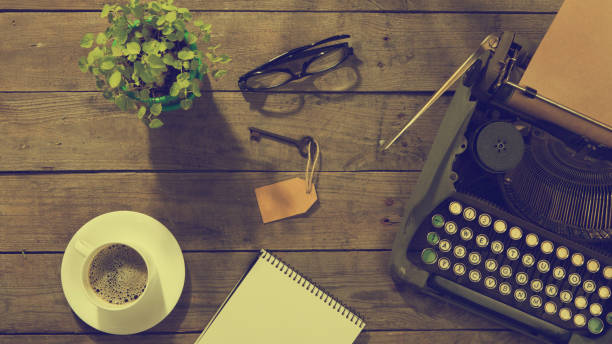 istock Vintage typewriter on the old wooden desk 1398624939