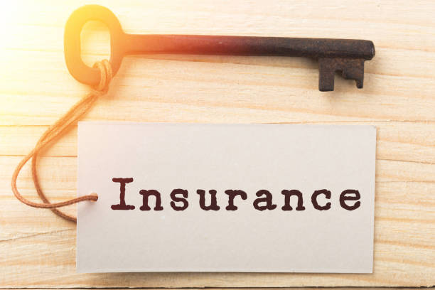 istock home insurance concept - old key with tag 1398625073