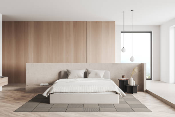 istock Light bedroom interior with bed on carpet, panoramic window on countryside 1398625168
