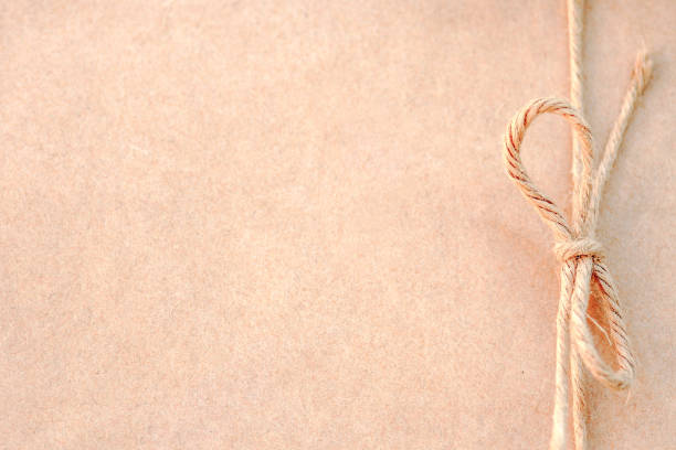 Brown corrugated cardboard paper texture background. Kraft paper for design background. Brown recycles paper sheet. Top view.