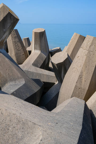 istock man made concrete sea wall groynes coastal protection from storms and waves 1398627972