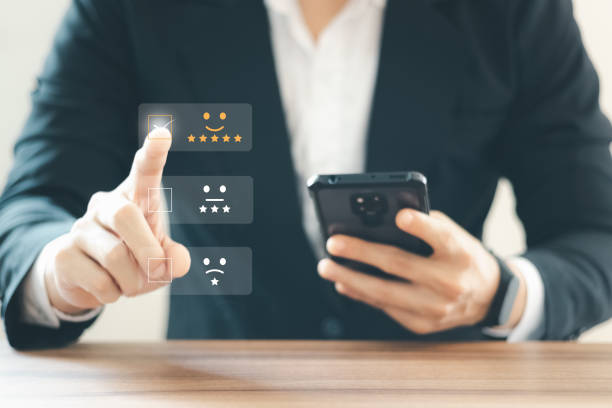 istock User give rating to service experience on online application, Customer review satisfaction feedback survey concept,  Customer can evaluate quality of service leading to reputation ranking of business. 1398628796