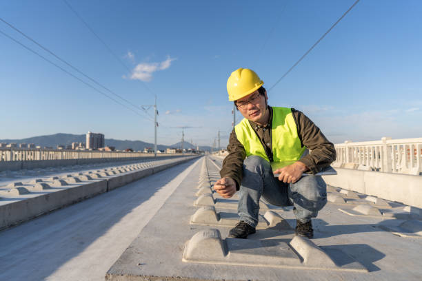 istock An Asian male railway worker is carefully examining some engineering problems 1398631724