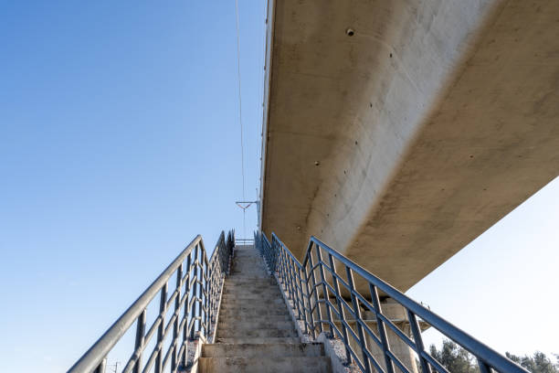 A stairway with guardrails leading to the viaduct