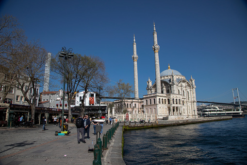 Historical Ortakoy (Mecidiye) mosque and Bosphorus view.Istanbul,Turkey.27 April 2022