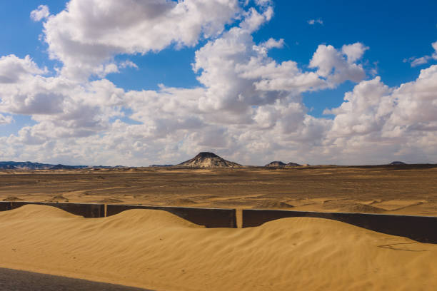 Panoramic View to the Sandy Hills in the Black Desert, is National park in the Farafra Oasis, Egypt