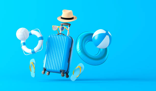 ブルースーツケースとビーチアクセサリー - business travel travel sky sea ストックフォトと画像