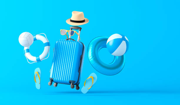 Blue Suitcase and Beach Accessories stock photo