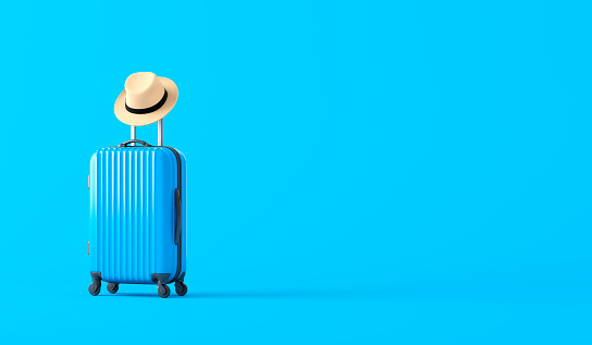 Suitcase and hat on a blue background. 3d illustration