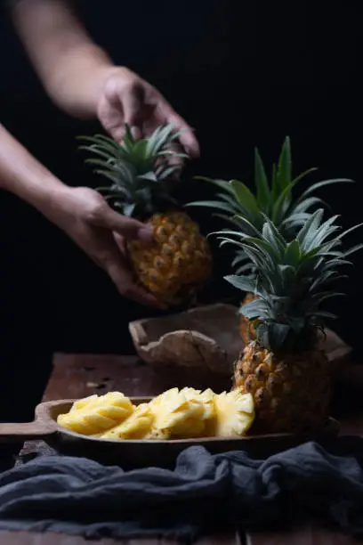 The pineapple or Ananas comosus is a tropical plant with an edible fruit, it is the most economically significant plant in the family Bromeliaceae.