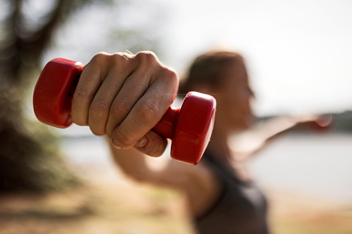 Exercises holding dumbbells