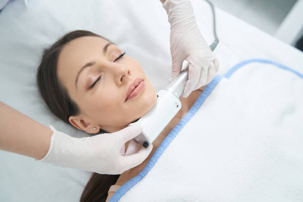 istock Woman with closed eyes enjoying beauty procedure with Microvibration Therapy 1398637778