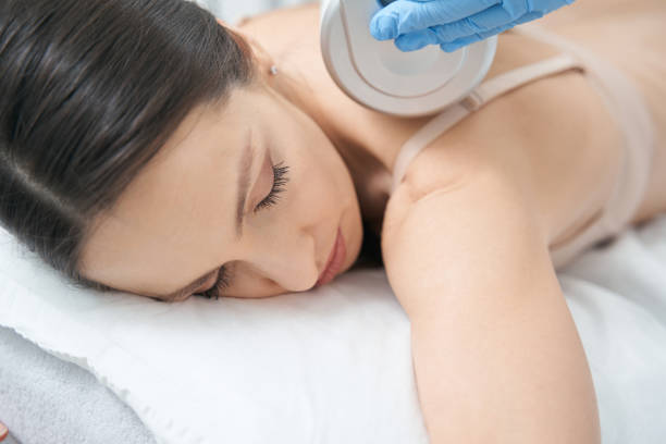 istock Neck massage of woman performed with Microvibration Therapy roller 1398637860