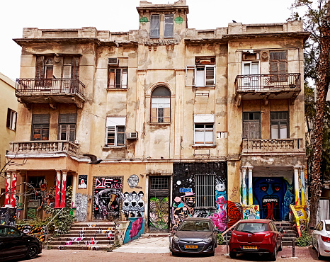 Front view of an abandoned building in the center of Tel Avi vcity. Tel Aviv is full of abandoned buildings and derelict construction sites.