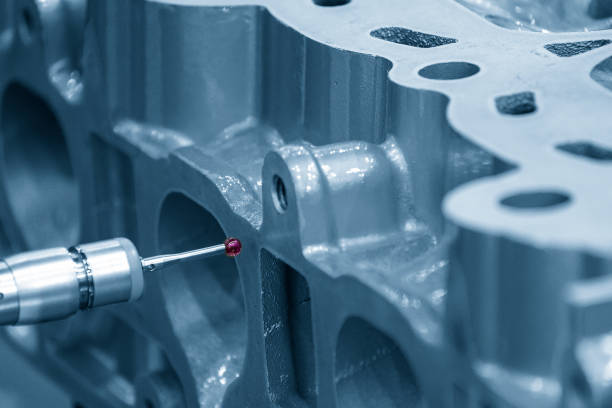 istock The multi-axis CMM machine measuring the cylinder head parts . 1398644493