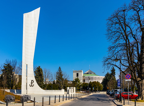 Warsaw, Poland - March 25, 2022: Monument to World War II Polish Underground State and Home Army by Jerzy Staniszkis in front of Sejm Chamber of Parliament in Srodmiescie Ujazdow district