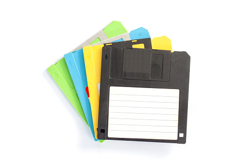 Top view of vintage floppy disk magnetic computer isolated on white background.