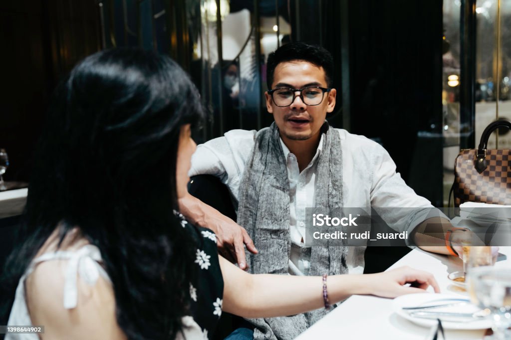 couple are quarreling in the restaurant Adult Stock Photo
