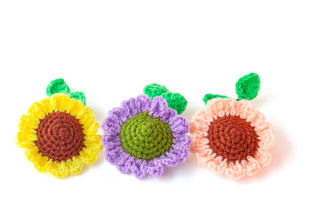 istock Crochet varicolored Sunflower made from yarn isolated on white background. 1398644926