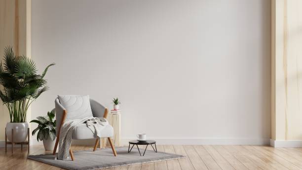 istock Modern minimalist interior with a gray armchair on empty white wall background. 1398645179