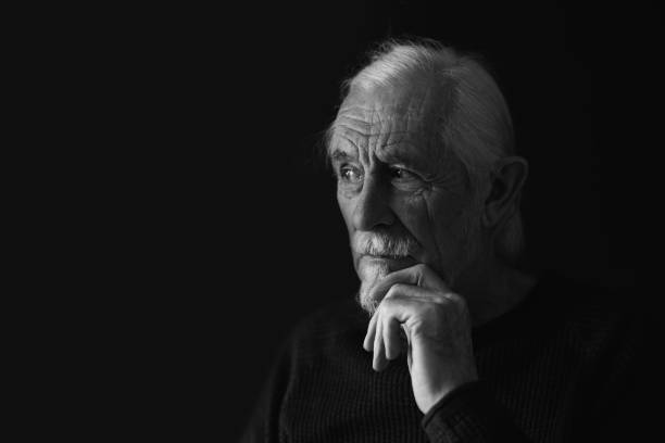 istock Black and white studio portrait of pensive old man 1398647238