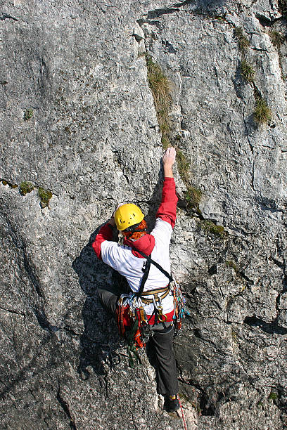 Female Climber in route stock photo