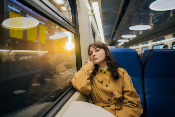 istock Woman using  smartphone while  traveling in the train 1398649105