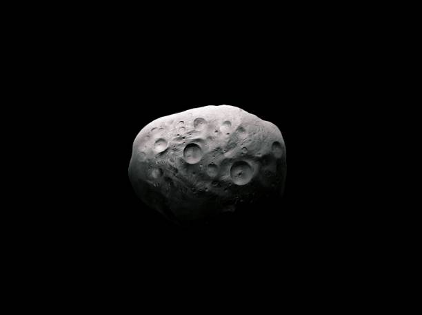 istock Asteroid covered with craters. Space rock on a black background. 1398649209