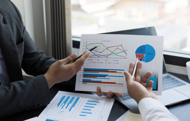 istock Close up business team analyzing income charts and graphs. Business analysis and strategy concept. 1398651343