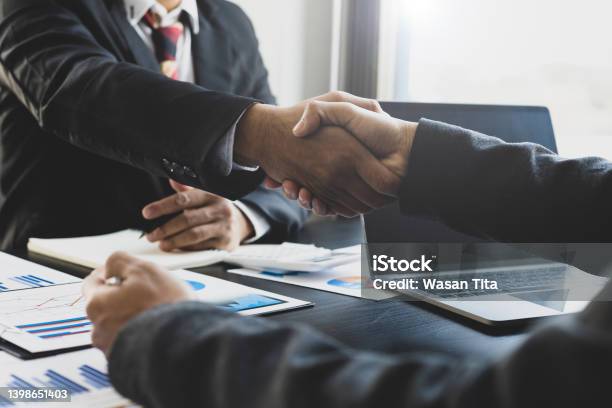 Handshake Businessmen Are Agreeing On Business Together And Shaking Hands After A Successful Negotiation Stock Photo - Download Image Now