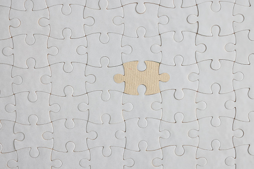 Blank jigsaw piece isolated on white with clipping path.