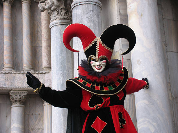 Venice Carnival: Joker mask in front of pillars stock photo