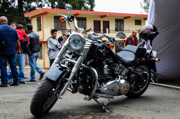 Harley Davidson motorbike or fat boy bike kept for display in an exhibition Shillong, India - October 05, 2012: Harley Davidson motorbike or fat boy bike kept for display in an exhibition harley davidson fat boy stock pictures, royalty-free photos & images