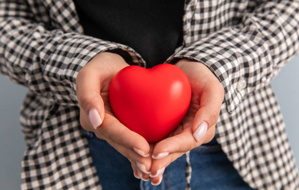 istock woman holding red heart 1398654014